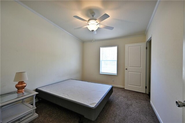 13585 Oswald Rd, Drummond, WI 54832 - bedroom with baseboards, ornamental molding, dark carpet, and ceiling fan