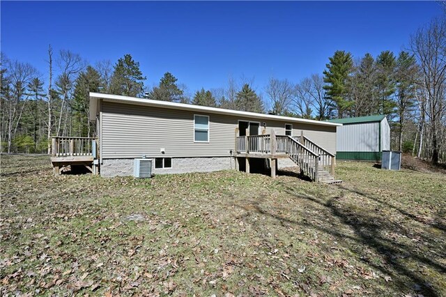 13585 Oswald Rd, Drummond, WI 54832 - back of house with central air condition unit and a deck
