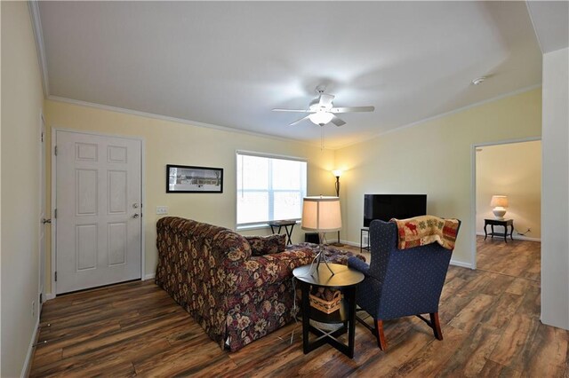 13585 Oswald Rd, Drummond, WI 54832 - living room with crown molding, a ceiling fan, baseboards, and dark wood-type flooring