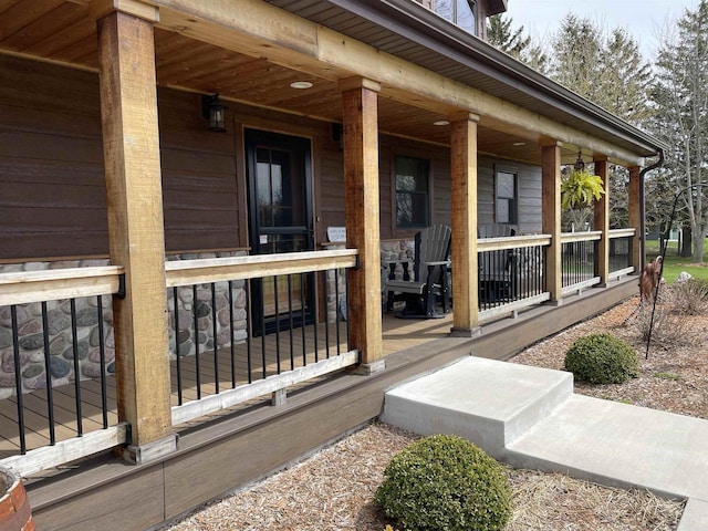 view of property exterior with covered porch