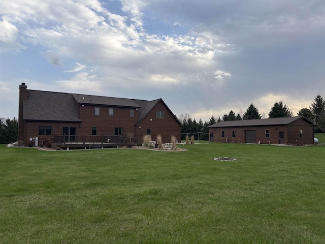 view of yard featuring a fire pit and a deck