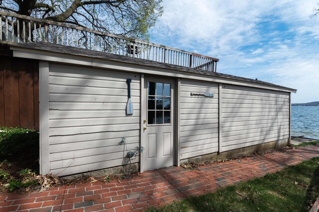 W347N5904 Lake Dr, Oconomowoc, WI 53066 - view of outbuilding with a water view