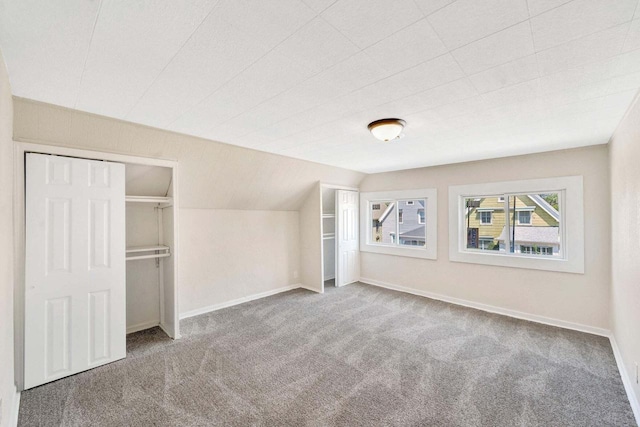 unfurnished bedroom with baseboards and carpet