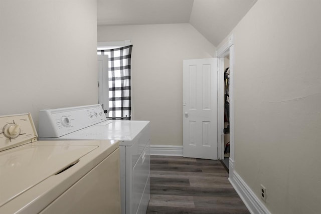 washroom with independent washer and dryer, dark wood-style flooring, and laundry area