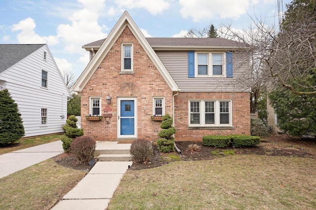 1517 Torrison Dr, Manitowoc, WI 54220 - view of front of property featuring brick siding and a front lawn