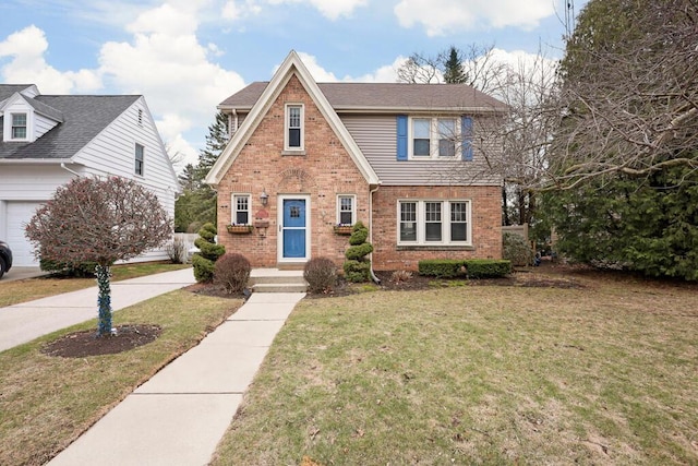 1517 Torrison Dr, Manitowoc, WI 54220 - view of front of house featuring brick siding and a front yard