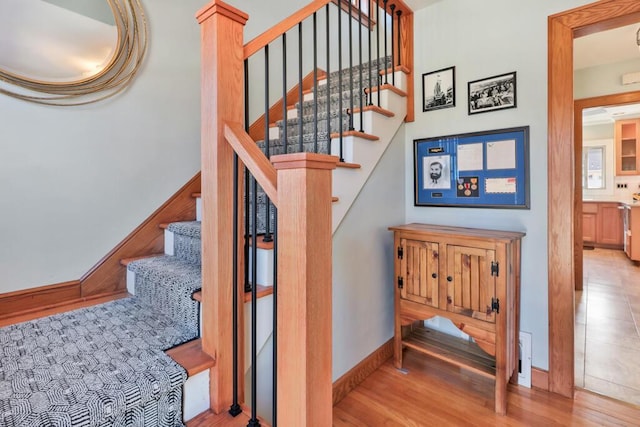 1517 Torrison Dr, Manitowoc, WI 54220 - staircase with wood finished floors and baseboards