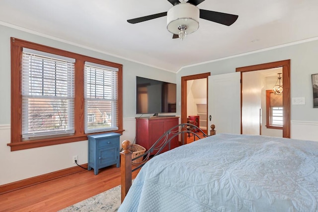 1517 Torrison Dr, Manitowoc, WI 54220 - bedroom featuring ornamental molding, wood finished floors, baseboards, and ceiling fan