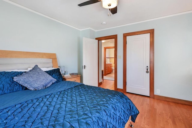 1517 Torrison Dr, Manitowoc, WI 54220 - bedroom featuring wood finished floors, baseboards, ornamental molding, and a ceiling fan