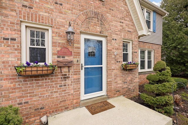 1517 Torrison Dr, Manitowoc, WI 54220 - view of exterior entry featuring brick siding