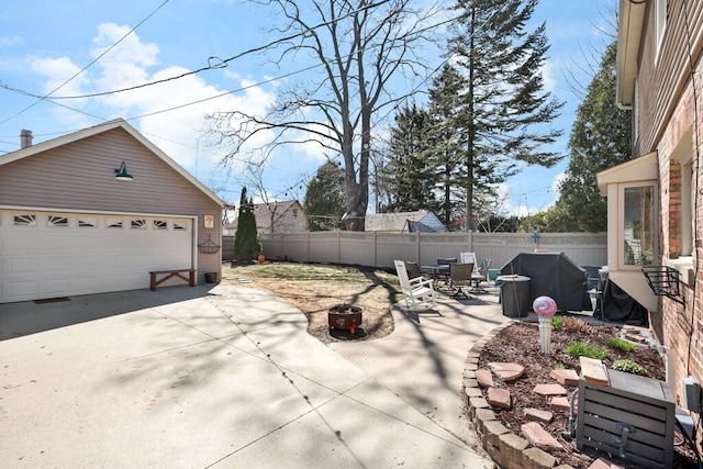 1517 Torrison Dr, Manitowoc, WI 54220 - view of patio / terrace with a detached garage, an outbuilding, and area for grilling