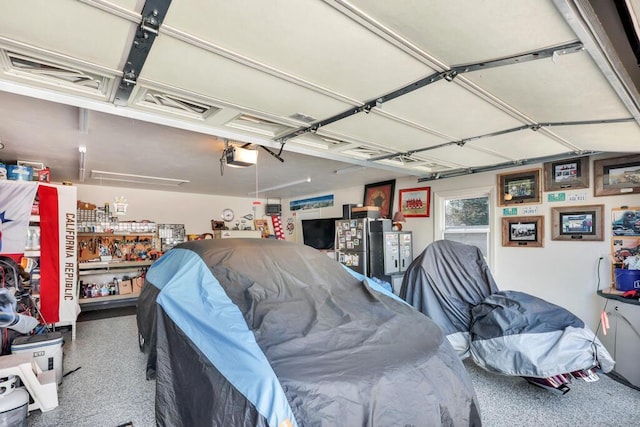 1517 Torrison Dr, Manitowoc, WI 54220 - garage featuring a garage door opener
