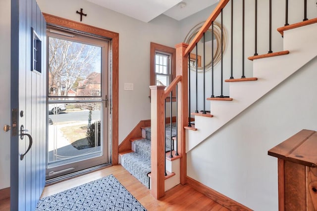 1517 Torrison Dr, Manitowoc, WI 54220 - entrance foyer with wood finished floors, stairway, and baseboards