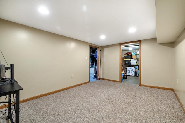 finished below grade area featuring baseboards, carpet flooring, and recessed lighting