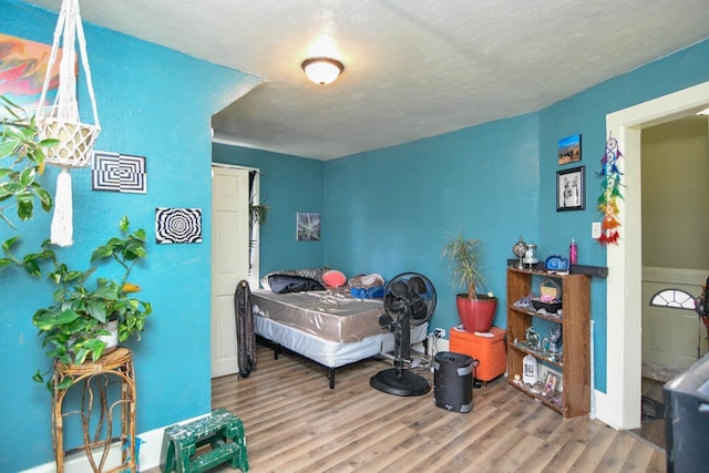 bedroom with wood finished floors