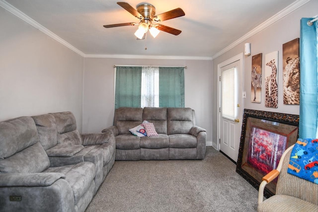 living room with ceiling fan, ornamental molding, and carpet flooring