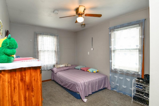 carpeted bedroom with ceiling fan