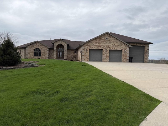 457 Union Rd, Brooklyn, WI 53521 - view of front of house with a garage, driveway, stone siding, and a front yard
