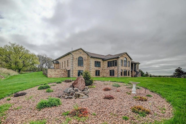 457 Union Rd, Brooklyn, WI 53521 - view of front facade with a front lawn and stone siding