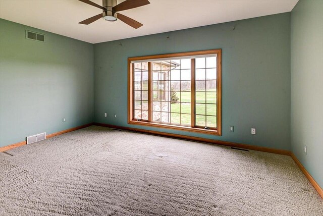 457 Union Rd, Brooklyn, WI 53521 - carpeted spare room featuring baseboards, ceiling fan, and visible vents