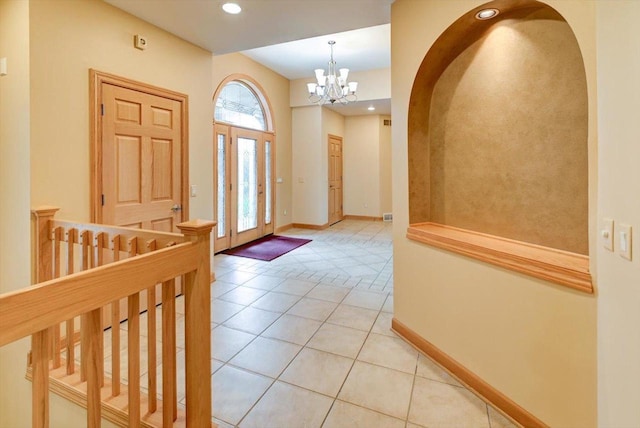 457 Union Rd, Brooklyn, WI 53521 - entryway with baseboards, recessed lighting, a chandelier, arched walkways, and light tile patterned floors