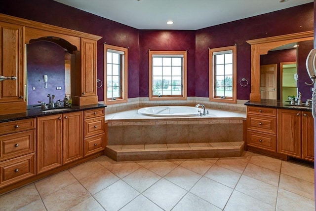 457 Union Rd, Brooklyn, WI 53521 - full bath featuring two vanities, a sink, tile patterned flooring, and a garden tub