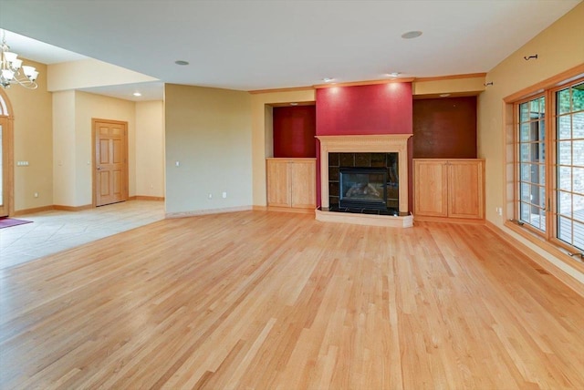 457 Union Rd, Brooklyn, WI 53521 - unfurnished living room with a fireplace, baseboards, light wood finished floors, a chandelier, and recessed lighting