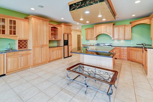 457 Union Rd, Brooklyn, WI 53521 - kitchen with light brown cabinets, stove, custom range hood, a sink, and paneled refrigerator with ice dispenser