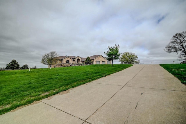 457 Union Rd, Brooklyn, WI 53521 - view of front of property featuring a garage, a front lawn, and concrete driveway