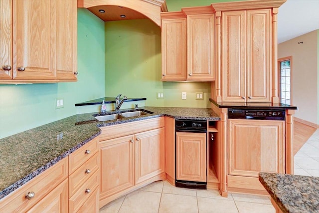 457 Union Rd, Brooklyn, WI 53521 - kitchen with a sink, dark stone counters, light tile patterned floors, and light brown cabinetry