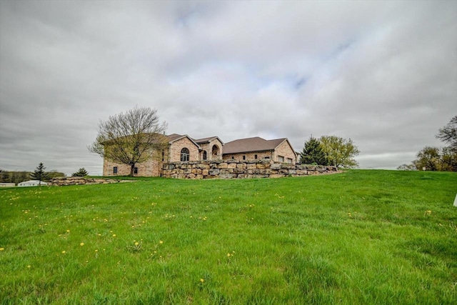 457 Union Rd, Brooklyn, WI 53521 - view of front facade with stone siding and a front lawn