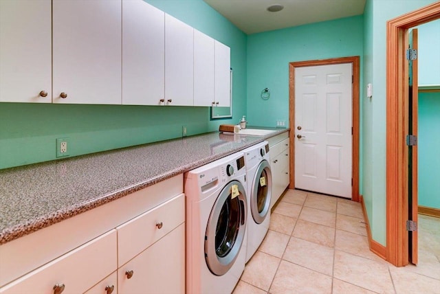 457 Union Rd, Brooklyn, WI 53521 - laundry room with light tile patterned flooring, washer and dryer, baseboards, a sink, and cabinet space