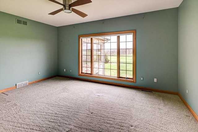 457 Union Rd, Brooklyn, WI 53521 - spare room featuring carpet floors, a ceiling fan, baseboards, and visible vents
