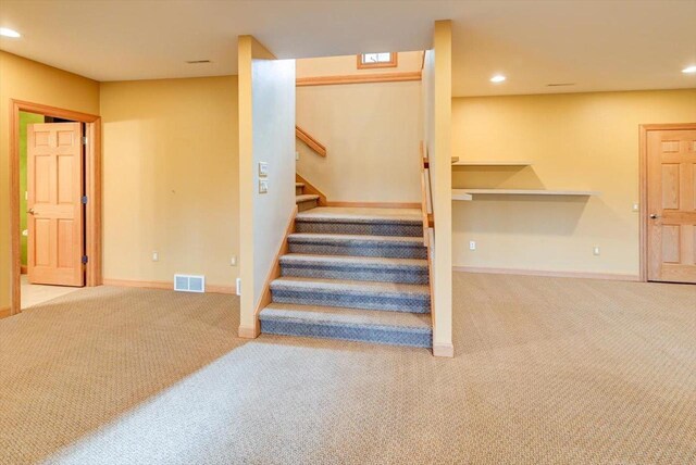 457 Union Rd, Brooklyn, WI 53521 - stairway with baseboards, carpet flooring, and visible vents