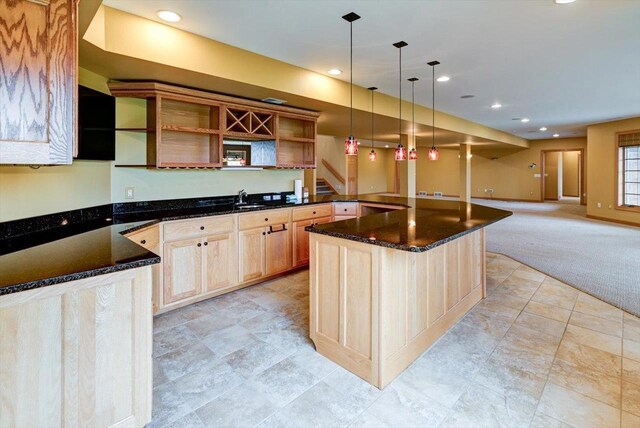 457 Union Rd, Brooklyn, WI 53521 - kitchen featuring dark stone counters, open shelves, pendant lighting, and light carpet