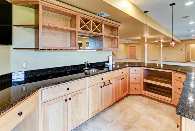 457 Union Rd, Brooklyn, WI 53521 - kitchen with pendant lighting, open shelves, a sink, dark stone countertops, and light brown cabinets