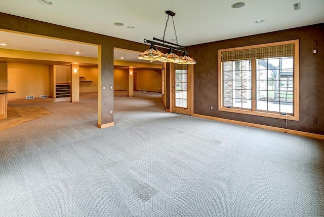 457 Union Rd, Brooklyn, WI 53521 - unfurnished dining area featuring baseboards, light carpet, stairs, and visible vents