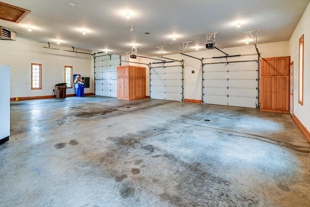 457 Union Rd, Brooklyn, WI 53521 - garage featuring baseboards and a garage door opener