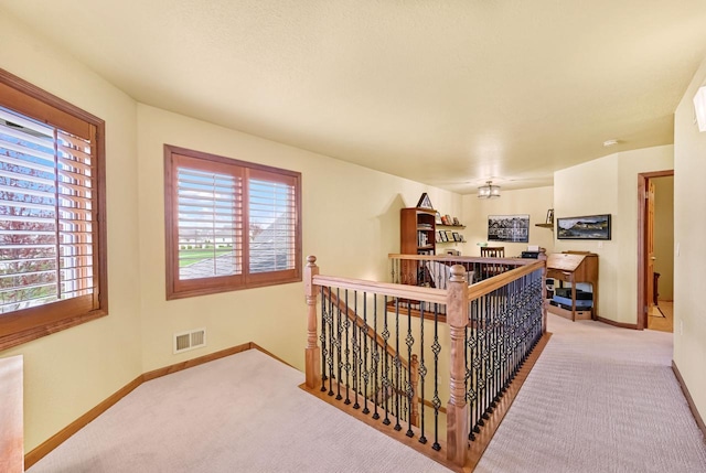 3500 Sequoia Cir, Waukesha, WI 53188 - hall featuring baseboards, light carpet, an upstairs landing, and visible vents