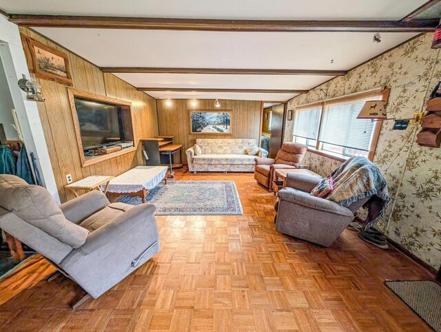 W7150 Maple Ridge Ln, Phillips, WI 54555 - living room featuring wooden walls, baseboards, beamed ceiling, and wallpapered walls