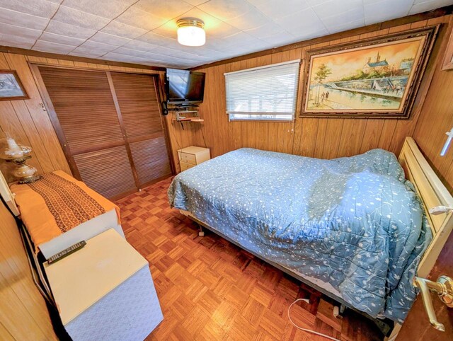 W7150 Maple Ridge Ln, Phillips, WI 54555 - bedroom with wooden walls and a closet