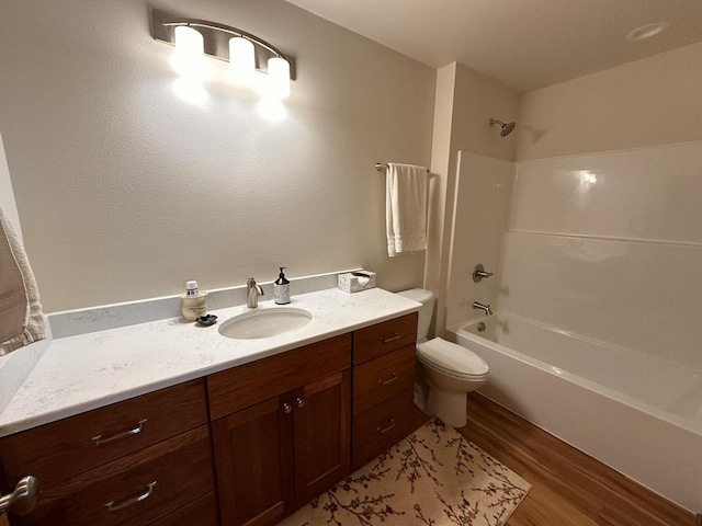 full bathroom with vanity, shower / bathing tub combination, toilet, and wood finished floors