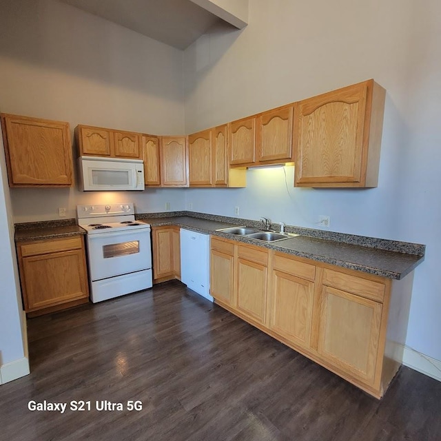 201-207 S Main St, Jefferson, WI 53549 - kitchen with a sink, light brown cabinetry, a high ceiling, and white appliances