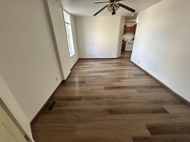 201-207 S Main St, Jefferson, WI 53549 - empty room featuring baseboards, ceiling fan, visible vents, and wood finished floors