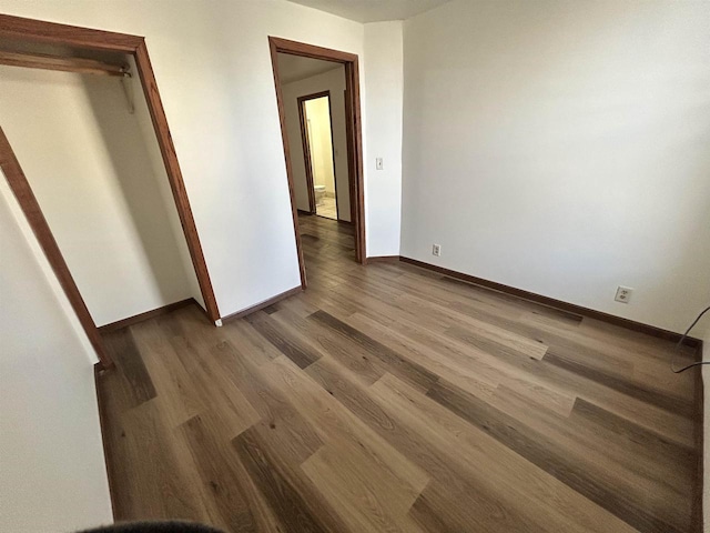 201-207 S Main St, Jefferson, WI 53549 - unfurnished bedroom with baseboards and wood finished floors