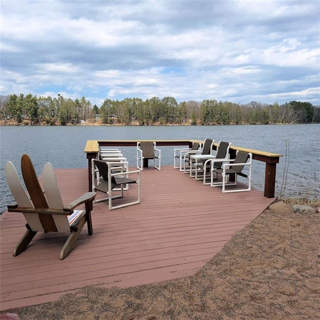 dock area featuring a water view and a forest view