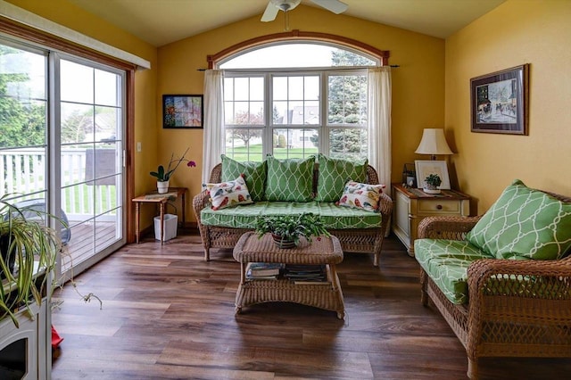 sitting room with a ceiling fan, vaulted ceiling, and wood finished floors