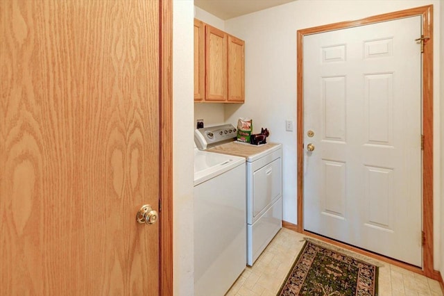 laundry room featuring cabinet space and independent washer and dryer
