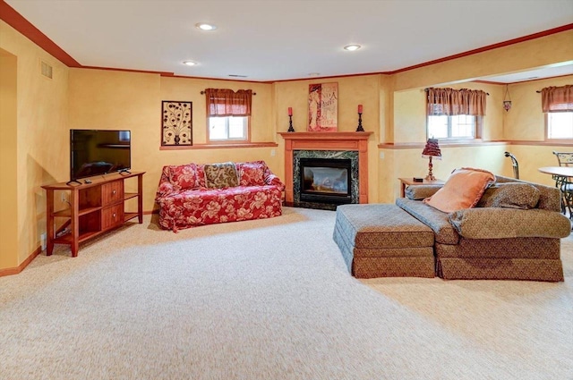 carpeted living area featuring recessed lighting, ornamental molding, and a fireplace