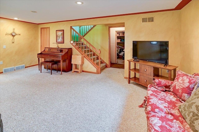 carpeted living area with crown molding, baseboards, stairs, and visible vents